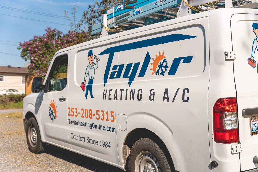 White service van with Taylor Heating & A/C branding, phone number 253-208-5315, and tagline Comfort Since 1984 displayed on the side.